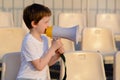 Little football fan with megaphone Royalty Free Stock Photo