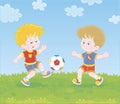 Little football players kicking a ball Royalty Free Stock Photo