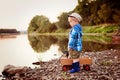 A little four years old sad boy looking for something on the river Royalty Free Stock Photo