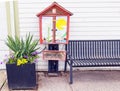 Little free library with bench to sit and read books