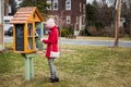 Little Free Street Library on a House Front yard in Suburb and a