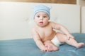 Little funny baby boy with big blue eyes smiling with cute cap with ears on his head Royalty Free Stock Photo