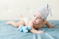 Little funny baby boy with big blue eyes smiling with cute cap on his head Royalty Free Stock Photo
