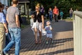 A little funny baby boy and his mother walking around Kolomenskoye park.