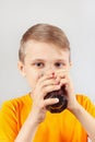Little funny blonde boy drinking fresh cola Royalty Free Stock Photo