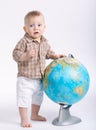 Little funny boy with globe on white Royalty Free Stock Photo