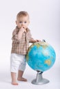Little funny boy with globe on white Royalty Free Stock Photo