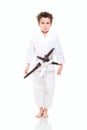 Little funny boy in kimono with swords Royalty Free Stock Photo