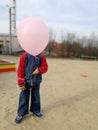 little funny boy with pink balloon, instead of head Royalty Free Stock Photo