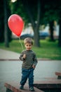 Little funny boy with red balloon Royalty Free Stock Photo