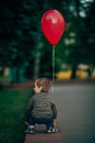 Little funny boy with red balloon Royalty Free Stock Photo