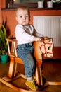 Little funny boy riding horse Royalty Free Stock Photo