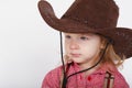 Little funny cowgirl on white background Royalty Free Stock Photo