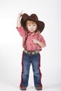 Little funny cowgirl on white background Royalty Free Stock Photo