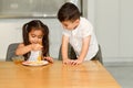 Little Funny Girl And Boy Eating Apple With Honey. Healthy Eating For Children. Royalty Free Stock Photo