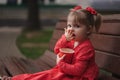 Little girl with cup of popcorn in park Royalty Free Stock Photo