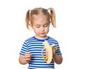 Little Funny girl eats banana.