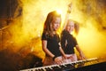 Little girl play on synthesizer in music studio Royalty Free Stock Photo