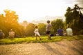 Little funny girl playing on green grass, Prague, august 2015