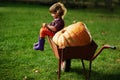 Little funny girl with pumpkins