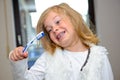 Little funny girl with retainer and toothbrush