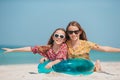 Little happy funny girls have a lot of fun at tropical beach playing together Royalty Free Stock Photo