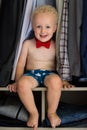 Little gentleman. Cute and handsome boy with curly blond hair Royalty Free Stock Photo
