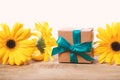 Little gift box with with yellow flowers