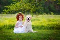 LIttle ginger girl and big dog bestfriend on nature background Royalty Free Stock Photo