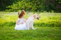LIttle ginger girl and big dog bestfriend on nature background Royalty Free Stock Photo