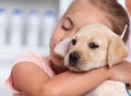 Little gir hugging her new puppy she just got Royalty Free Stock Photo