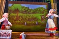 A little girl and an adult woman in Russian national dress rehearsing on stage. Mother and daughter sing and dance together Royalty Free Stock Photo