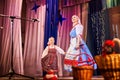 A little girl and an adult woman in Russian national dress rehearsing on stage. Mother and daughter sing and dance together Royalty Free Stock Photo