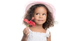 Little girl with an afro hairstyle holding a red flower Royalty Free Stock Photo
