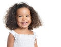 Little girl with an afro hairstyle smiling and wearing a white dress Royalty Free Stock Photo