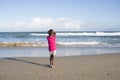 Little girl alone on beach. Royalty Free Stock Photo