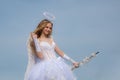 Little girl with angel wings and halo. Bow and arrow. Cupid cute girl with a bow. Space for text. Angel child girl with Royalty Free Stock Photo