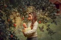 Little girl in the apple garden Royalty Free Stock Photo