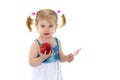 Little girl with apple. Isolated on white background.