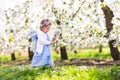 Little girl in apple tree garden Royalty Free Stock Photo