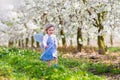 Little girl in apple tree garden Royalty Free Stock Photo