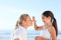 Little girl applying sun cream Royalty Free Stock Photo