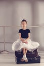 The little girl as balerina dancer sitting at studio Royalty Free Stock Photo