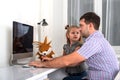 Little girl asks a busy dad  computer he give her attention and play with her Royalty Free Stock Photo