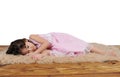 Little girl asleep on furry brown rug Royalty Free Stock Photo