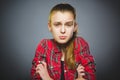 Little girl with astonished expression while standing against grey background Royalty Free Stock Photo