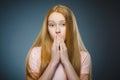 Little girl with astonished expression while standing against grey background Royalty Free Stock Photo