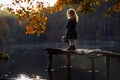 Little girl in autumn with a basket of apples. Harvesting apples