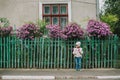 Little girl in the autumn park. pathway