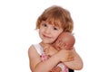 Little girl with baby doll toy Royalty Free Stock Photo